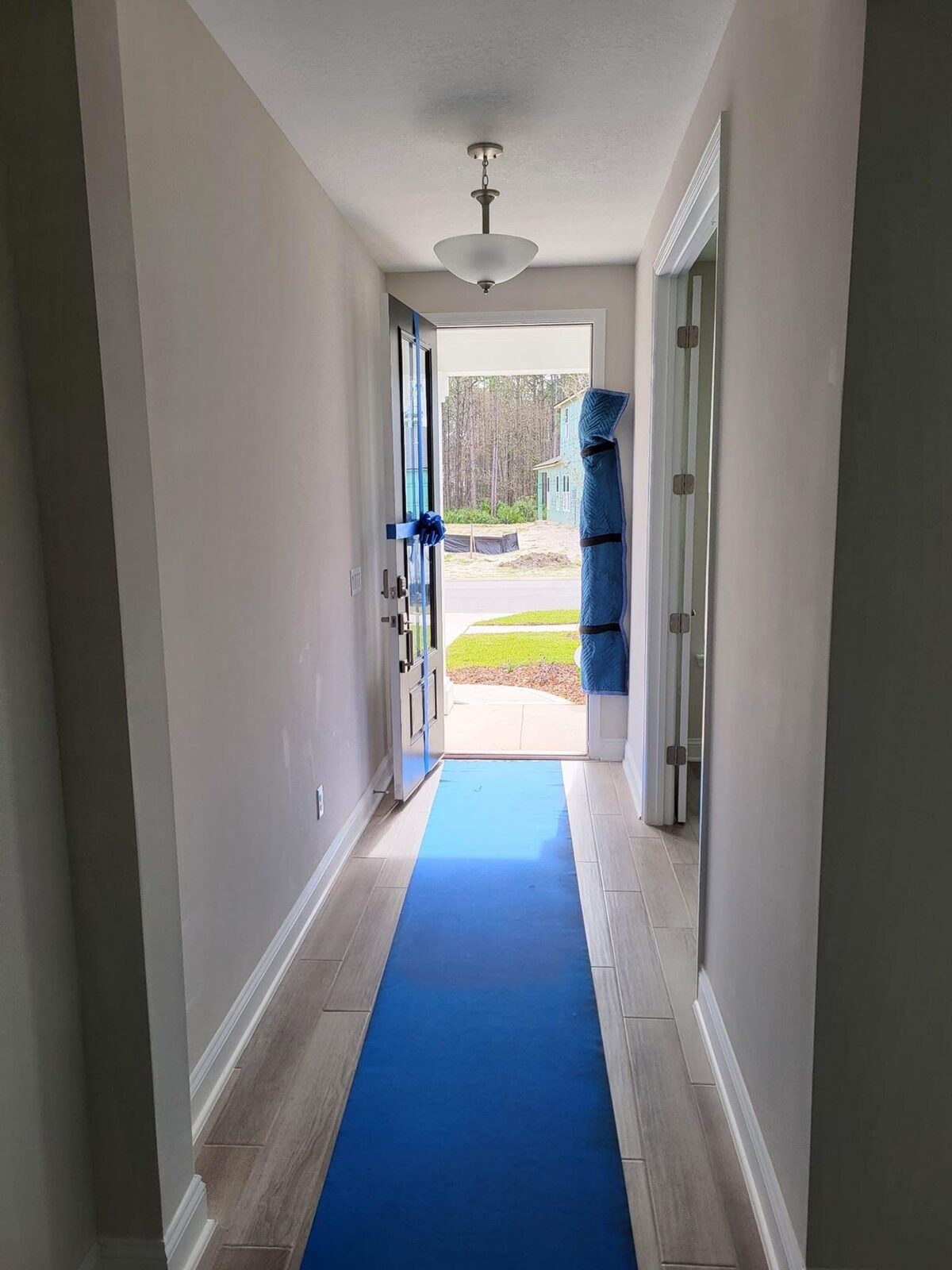 Floor runner laid down a hallway to protect floors during a move