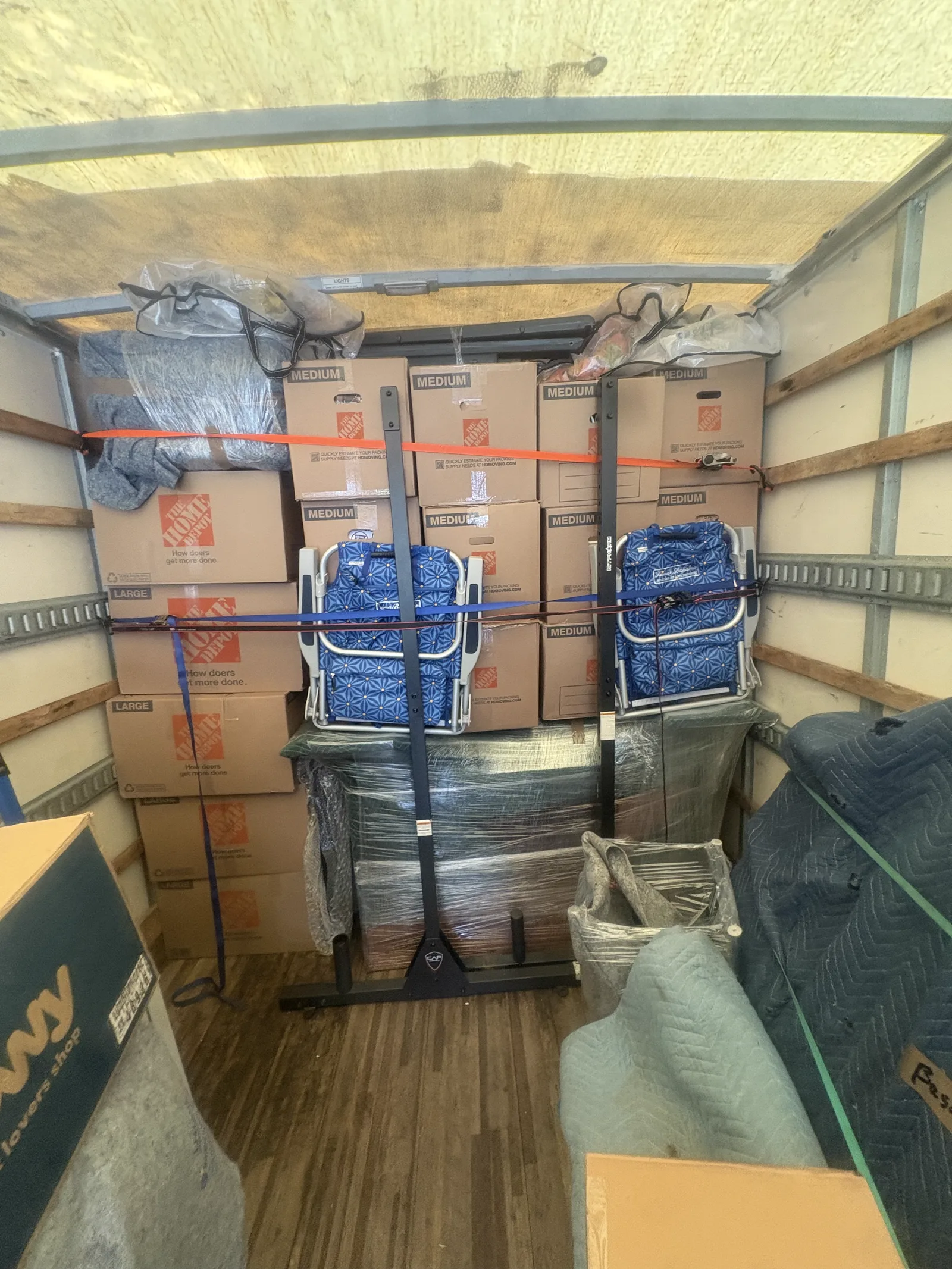A Royalty Moving truck packed with furniture wrapped and secured
